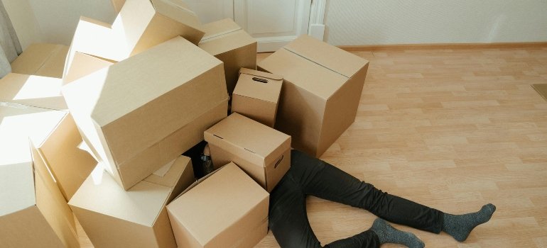 a man burdened with boxes