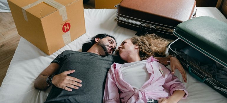 a young couple looking at each other while Renting storage during a hotel renovation in Brooklyn
