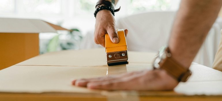 stretching boxes while Renting storage during a hotel renovation in Brooklyn