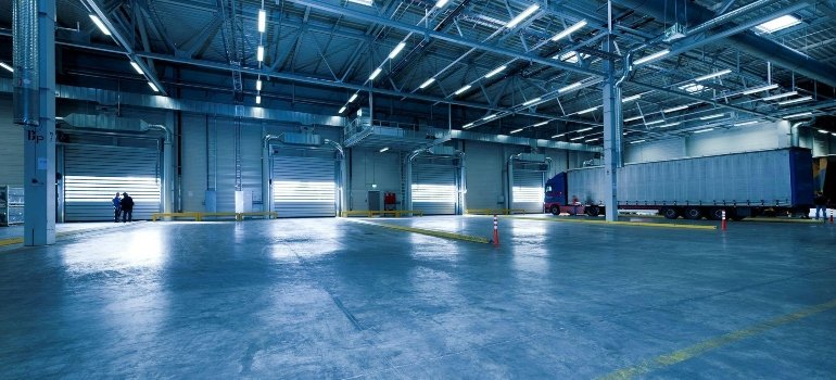 Large, clean warehouse with open bays and loading areas, representing the scale of an unusually cheap storage unit in Manhattan.