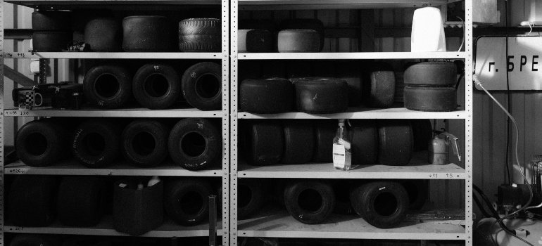 Monochrome Shot of Go-Karts Tires in the Shelf