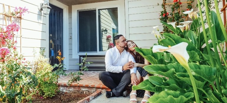 Young couple talking about NYC neighborhoods are in demand for renters