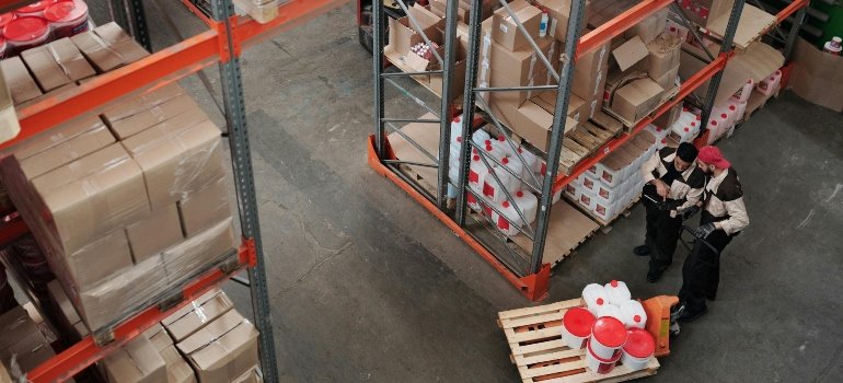 Two men are working at the warehouse.