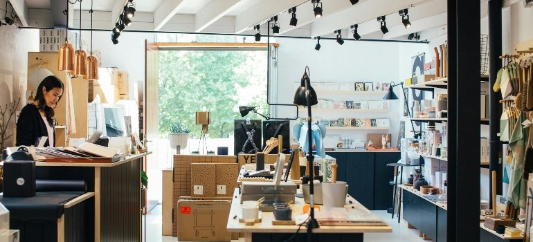 a girl working in the shop thinking about smart ways to deal with stored items before leaving NYC