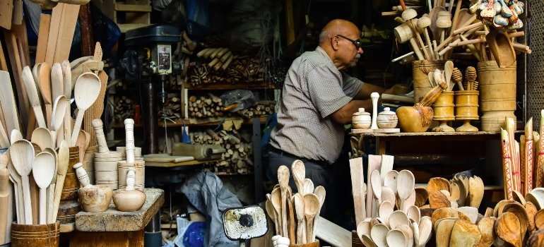 a man arranging things in the shop