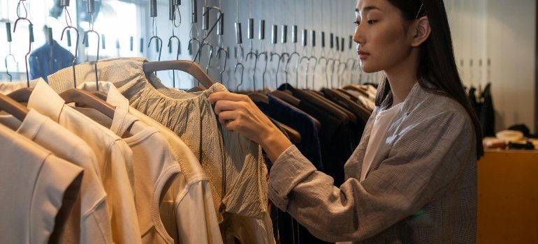 a girl buying T-shirt for as just-married couples living small in NYC