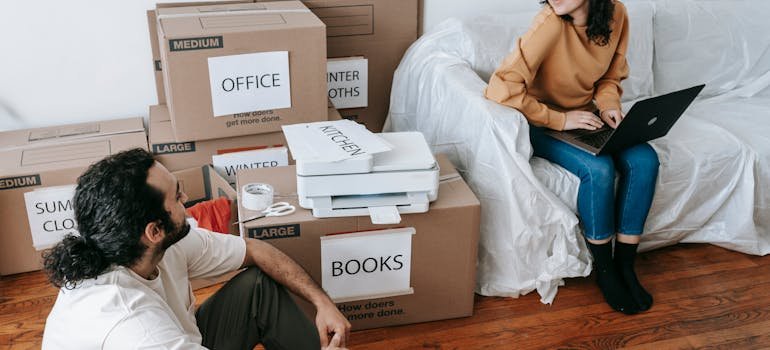 A couple sharing packing tips for climate controlled storage