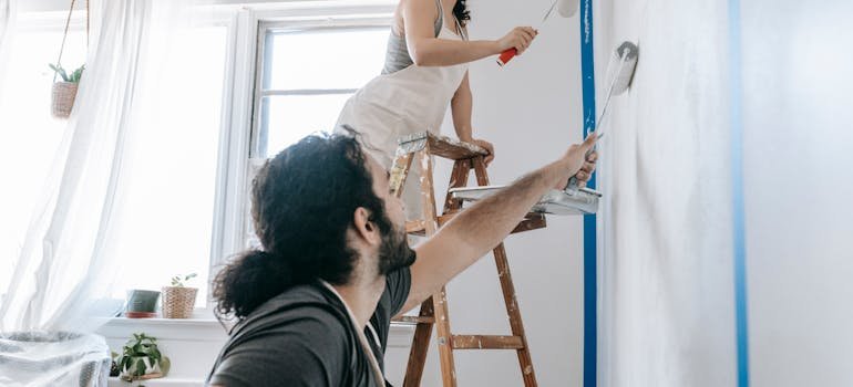 A family painting a wall
