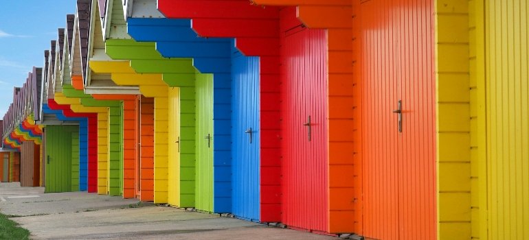 Colorful row of storage unit doors representing safe options for Business Storage in Manhattan.