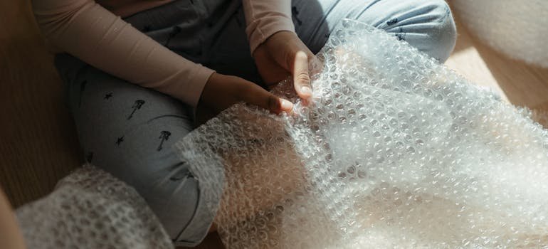 A person holding bubble wrap