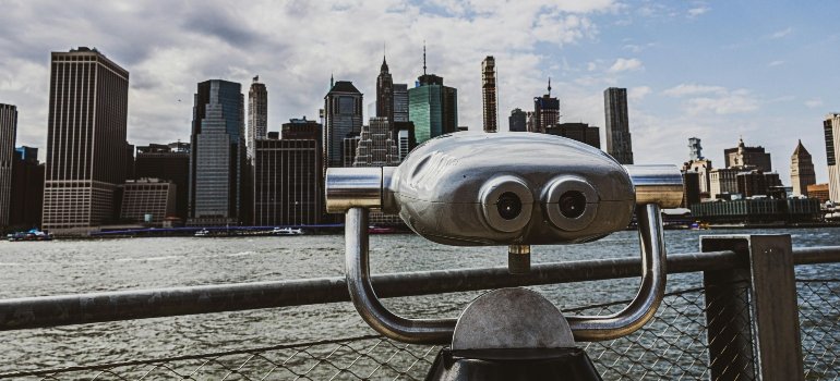 Viewing binoculars facing New York City skyline symbolizing future storage opportunities.