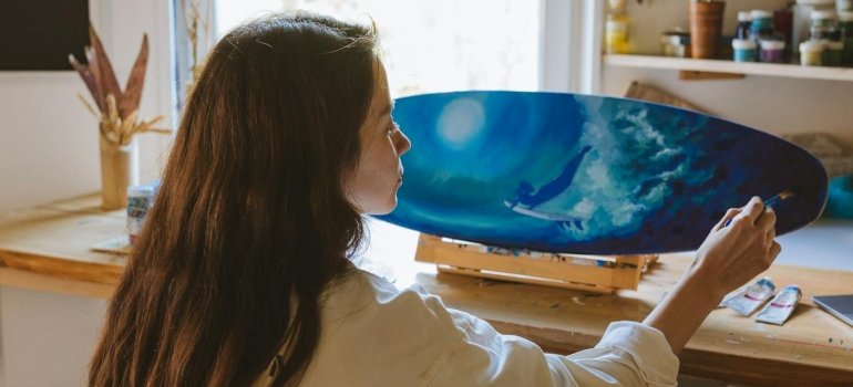 a woman preparing to move artwork cross country