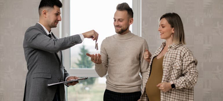 A couple talking with the real estate agent