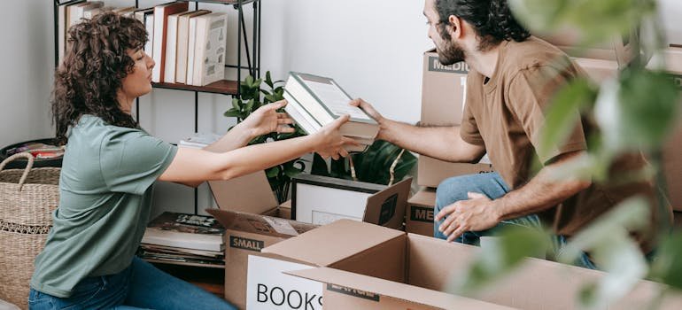 A couple decluttering by following NYC small apartment survival guide