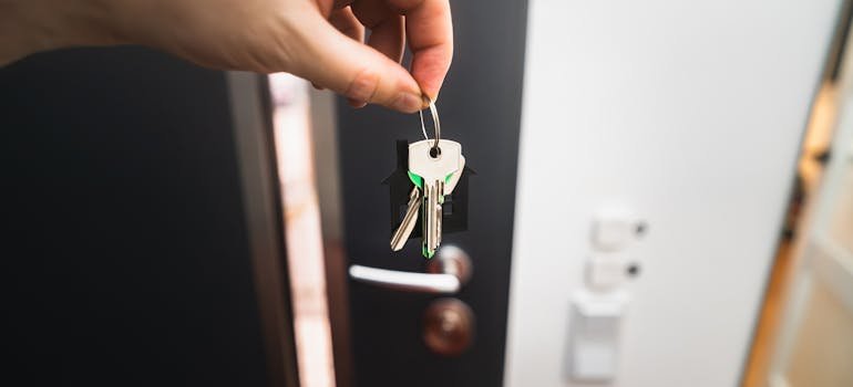 A person holding keys