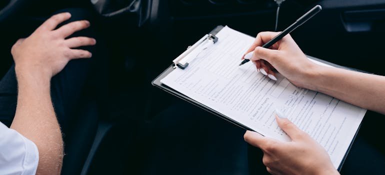 A person filling a form in order to prepare your car for winter storage in New York City