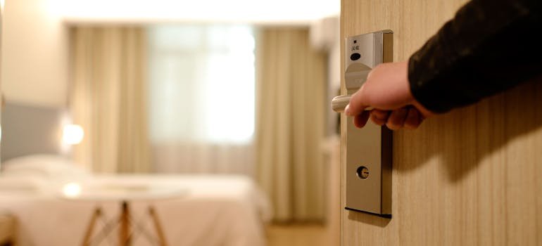 A person enetering a hotel room