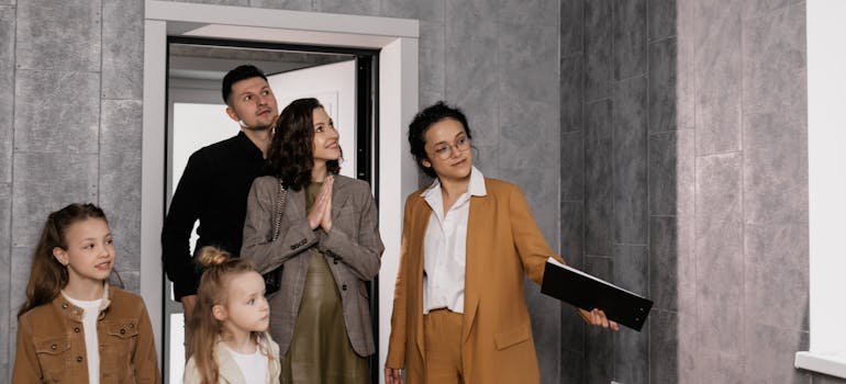 A family with the real estate agent