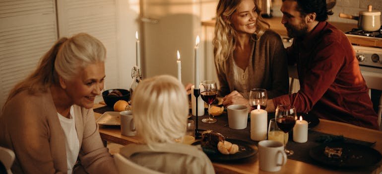 A family having dinner after moving during Thanksgiving