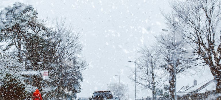 People in the car having winter move in the Bronx