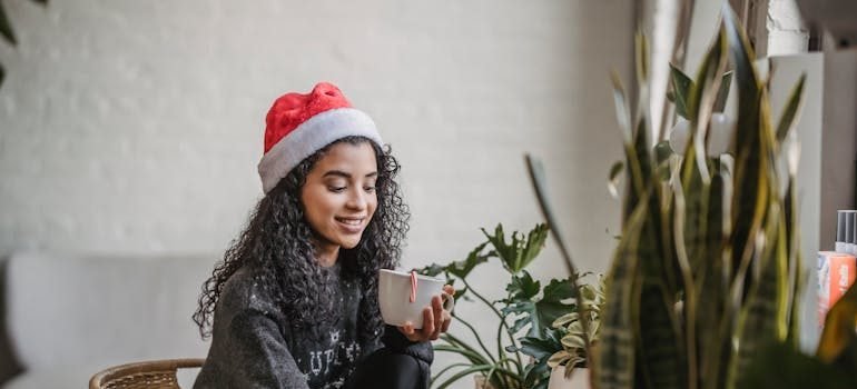 A woman having coffee and enjoying one of the winter activities in Manhattan