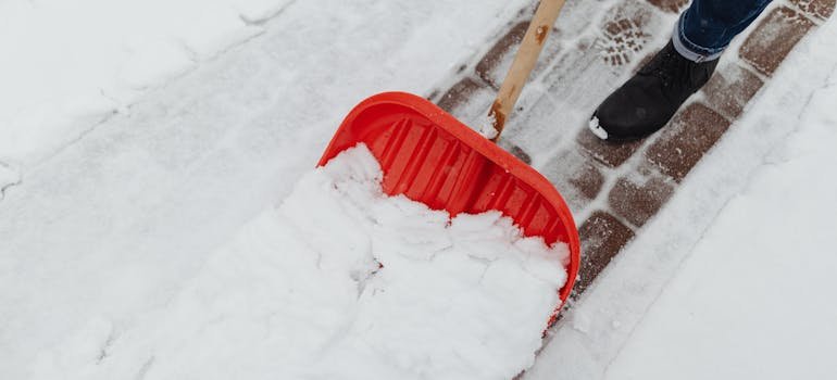 A person cleaning snow