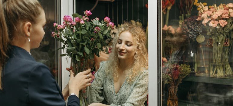 A woman keeping flowers in one of the storage solutions for event planners