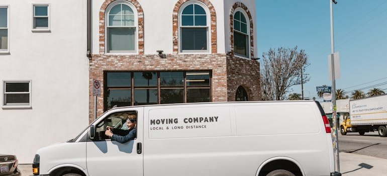 Parked moving van in front of the building