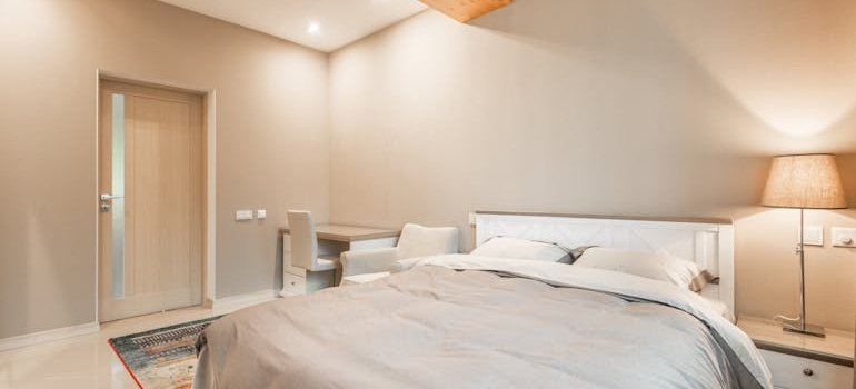 A desk next to the bed