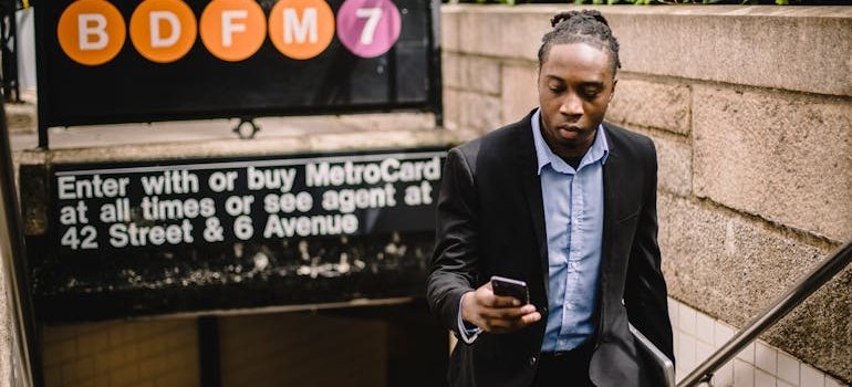 A man at the subway station adjusting to a Manhattan life after moving from a suburb