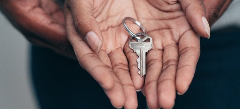 A couple holding a key