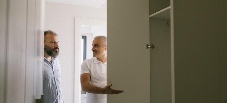 Two roommates who share a tiny New York apartment talking about the storage