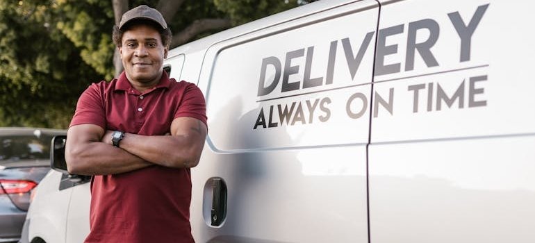 A person in front of the white van
