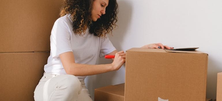 A woman packing for moving to the Upper East Side