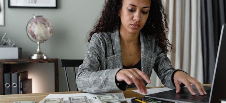 A woman using a calculator