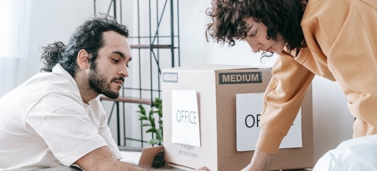 A couple packing boxes