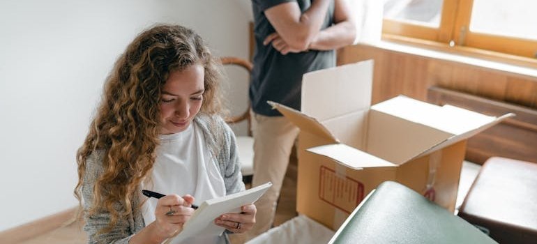 A couple making a plan before moving out of a Bronx home