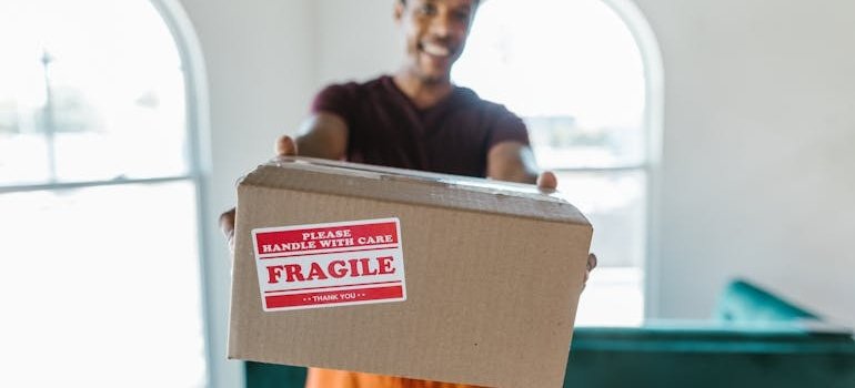 A man holding a mobing box