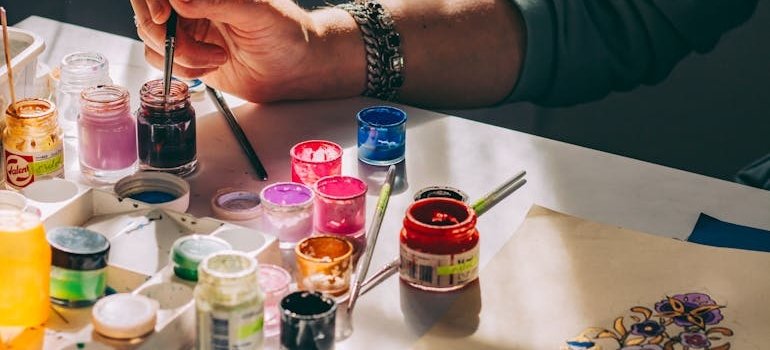 An artist using painting supplies