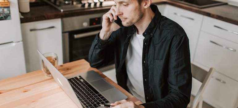 A man talking on the phone about the storage for remote workers in Manhattan apartments