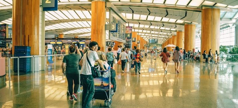 People at the airport talking about the reasons NYC residents choose vehicle storage