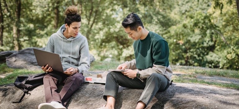 Two people sitting in the park