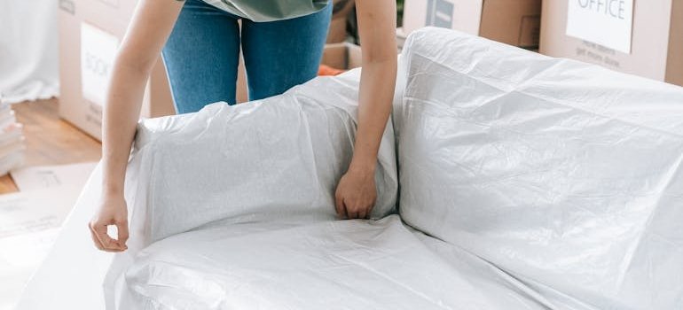 A person covering the sofa