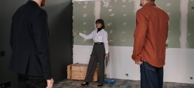 People in the office talking about how business storage beats renting a bigger office