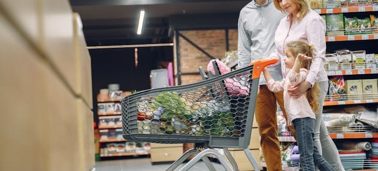 A family doing grocery and talking about how to choose the right Manhattan neighborhood