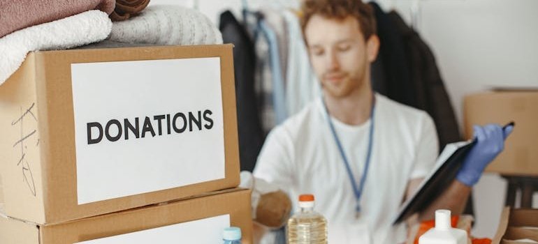A man preparing items for storing office furniture