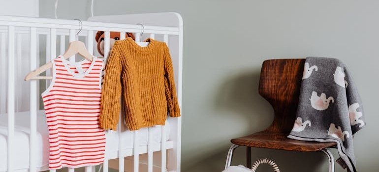 Baby clothes on the crib