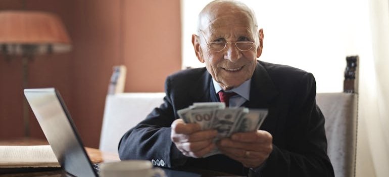 A man holding dollar bills