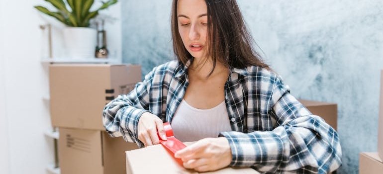 A woman packing and thinking what to leave for a pickup crew