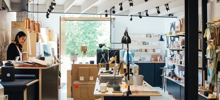 A woman thinking about storage ideas for small shops in Highbridge